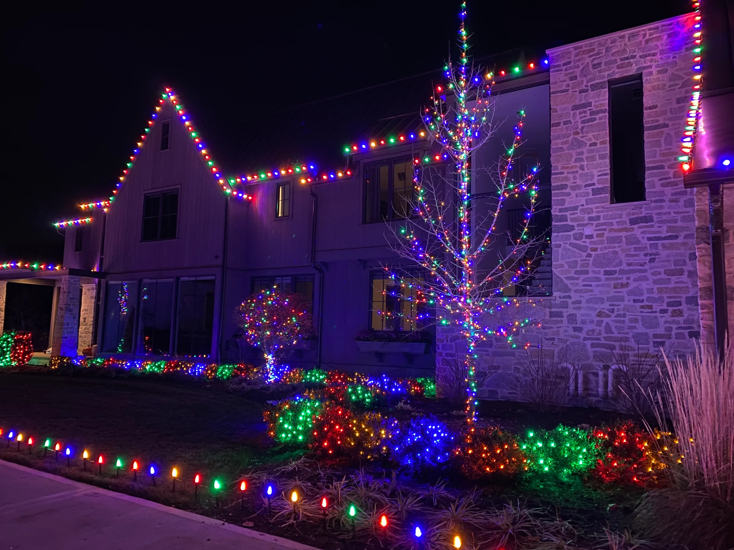 Residential Christmas lighting with a bright architectural outline